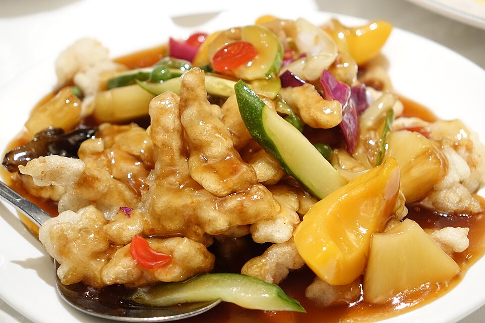Korean tangsuyuk, pieces of crispy fried pork with vegetables and sweet-and-sour sauce